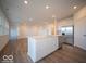 White kitchen features a large island and stainless steel appliances at 2298 Pine Valley Dr, Plainfield, IN 46168