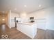 Modern kitchen with island and hardwood floors at 2298 Pine Valley Dr, Plainfield, IN 46168