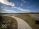 Curving paved pathway next to a pond at 6036 Card Blvd, Indianapolis, IN 46221