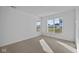 Bright bedroom with large window and carpet at 10549 Maidenhair Dr, Indianapolis, IN 46239