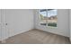 Spacious bedroom with neutral carpeting and large window at 10549 Maidenhair Dr, Indianapolis, IN 46239