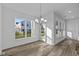 Sunlit dining area with hardwood floors and access to a patio at 10549 Maidenhair Dr, Indianapolis, IN 46239