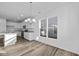 Bright eat-in kitchen with white cabinets and an island at 10549 Maidenhair Dr, Indianapolis, IN 46239