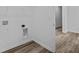 Laundry room with built-in shelving and access to another room at 10549 Maidenhair Dr, Indianapolis, IN 46239