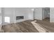 Spacious living room with hardwood floors and a modern fireplace at 10549 Maidenhair Dr, Indianapolis, IN 46239