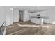Spacious living area with hardwood floors and an island kitchen at 10549 Maidenhair Dr, Indianapolis, IN 46239