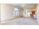 Open concept living room with vaulted ceilings and kitchen access at 1202 Creek Bend Dr, Greenwood, IN 46143