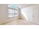 Bright bedroom with large window and neutral walls at 1202 Creek Bend Dr, Greenwood, IN 46143
