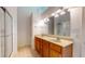 Bathroom with double vanity, large mirror and shower at 1202 Creek Bend Dr, Greenwood, IN 46143