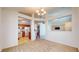 Spacious dining room with carpeting and views into the kitchen at 1202 Creek Bend Dr, Greenwood, IN 46143