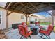 Covered patio with seating area and string lights at 9620 Claymore Dr, Fishers, IN 46038