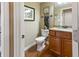 Clean bathroom with granite countertop and wood cabinets at 236 N Liberty Blvd, Mooresville, IN 46158