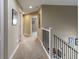 Upper hallway with carpet, doors to bedrooms, and a staircase at 236 N Liberty Blvd, Mooresville, IN 46158