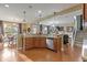 Open kitchen with large island and hardwood floors, overlooking living area at 236 N Liberty Blvd, Mooresville, IN 46158