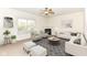 Spacious living room with corner fireplace and large windows at 12912 Broncos Dr, Fishers, IN 46037