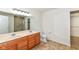 Bathroom boasts dual vanity sinks, shower, and a walk-in closet at 12912 Broncos Dr, Fishers, IN 46037
