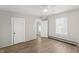 Simple bedroom with wood floors, ceiling fan and closet at 335 N Grant Ave, Indianapolis, IN 46201