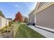Landscaped backyard with walkway, tree, and patio at 236 N Liberty Blvd, Mooresville, IN 46158