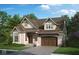 Brick home with a 2-car garage, dormer windows, and landscaped lawn at 947 W 146Th St, Carmel, IN 46074