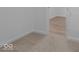 Bedroom with carpeted floor and access to another room at 10612 Maidenhair Dr, Indianapolis, IN 46239
