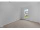 Spacious bedroom with neutral carpet and large window at 10612 Maidenhair Dr, Indianapolis, IN 46239