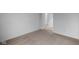 Carpeted bedroom with access to a hallway and another room at 10612 Maidenhair Dr, Indianapolis, IN 46239