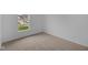 Bright bedroom with neutral carpet and window at 10612 Maidenhair Dr, Indianapolis, IN 46239