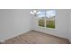 Bright dining room with chandelier and view of backyard at 10612 Maidenhair Dr, Indianapolis, IN 46239