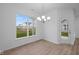 Dining room with backyard access and chandelier at 10612 Maidenhair Dr, Indianapolis, IN 46239