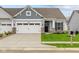 Two-story craftsman home with gray siding, white trim, and a two-car garage at 10612 Maidenhair Dr, Indianapolis, IN 46239