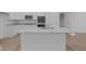 Modern kitchen island with quartz countertop at 10612 Maidenhair Dr, Indianapolis, IN 46239