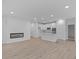 Open concept kitchen with white cabinets, stainless steel appliances, and an island at 10612 Maidenhair Dr, Indianapolis, IN 46239
