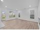 Spacious living room with hardwood floors and large windows at 10612 Maidenhair Dr, Indianapolis, IN 46239