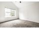 Spacious bedroom with neutral carpeting and large window at 1086 Distinctive Way, Greenfield, IN 46140