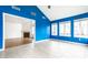 Sunroom with blue walls, tile floor, and multiple windows at 1086 Distinctive Way, Greenfield, IN 46140