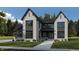 Stunning two-story home with gray and white exterior, a covered porch, and landscaping at 11135 Hamilton Run (Proposed Construction), Zionsville, IN 46077