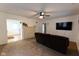 Spacious living room with a stone fireplace and large TV at 211 Taylor St, Mooresville, IN 46158