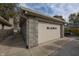 Attached garage with single door and block exterior at 5861 S 100 W, Fountaintown, IN 46130