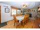 Charming dining room with wood floors and stone fireplace at 5861 S 100 W, Fountaintown, IN 46130