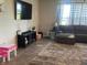 Spacious living room featuring a large sectional sofa and plush rug at 3503 W 100 N, Bargersville, IN 46106
