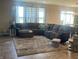 Spacious living room with sectional sofa and large rug at 3503 W 100 N, Bargersville, IN 46106