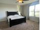 Bright bedroom with a king-size bed and large window at 3503 W 100 N, Bargersville, IN 46106