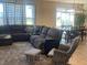 Open concept living space with a sectional sofa and adjacent dining area at 3503 W 100 N, Bargersville, IN 46106