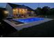 Inviting inground pool with a covered patio and string lights at 3503 W 100 N, Bargersville, IN 46106