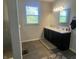 Bathroom with double vanity, walk-in shower and window at 3503 W 100 N, Bargersville, IN 46106