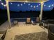 Covered patio area overlooking the pool at night at 3503 W 100 N, Bargersville, IN 46106