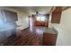 Kitchen features wood cabinets, granite counters, and wood flooring at 2620 Wicker Rd, Indianapolis, IN 46217