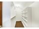 Bright white closet with hanging rods and shelves at 6640 Greenridge Dr, Indianapolis, IN 46278