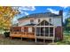 Two-story house with brick and siding, a deck and screened porch at 6640 Greenridge Dr, Indianapolis, IN 46278