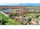 Aerial view showcasing house, lake, and neighborhood in autumn at 6640 Greenridge Dr, Indianapolis, IN 46278